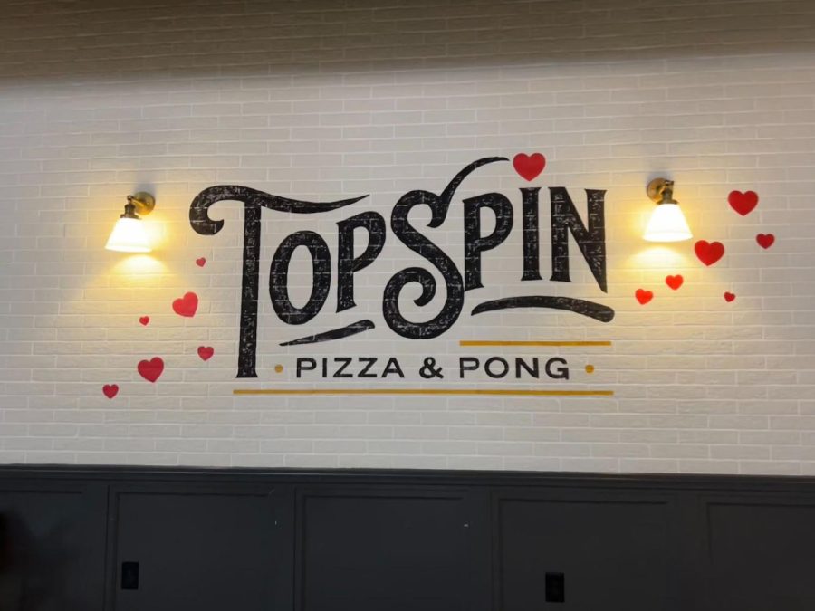 Topspin pizza logo painted on the wall at the restaurant 
