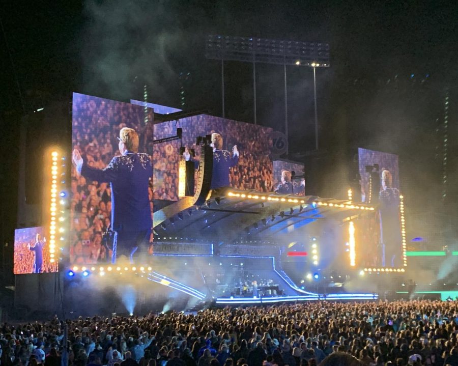 Photo of Elton John Facing the Crowd on Stage