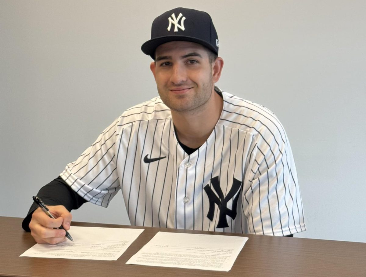 Chance Nolan signs his minor league deal with the New York Yankees.