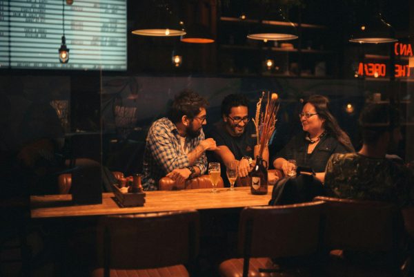 Group of people hanging out in a bar